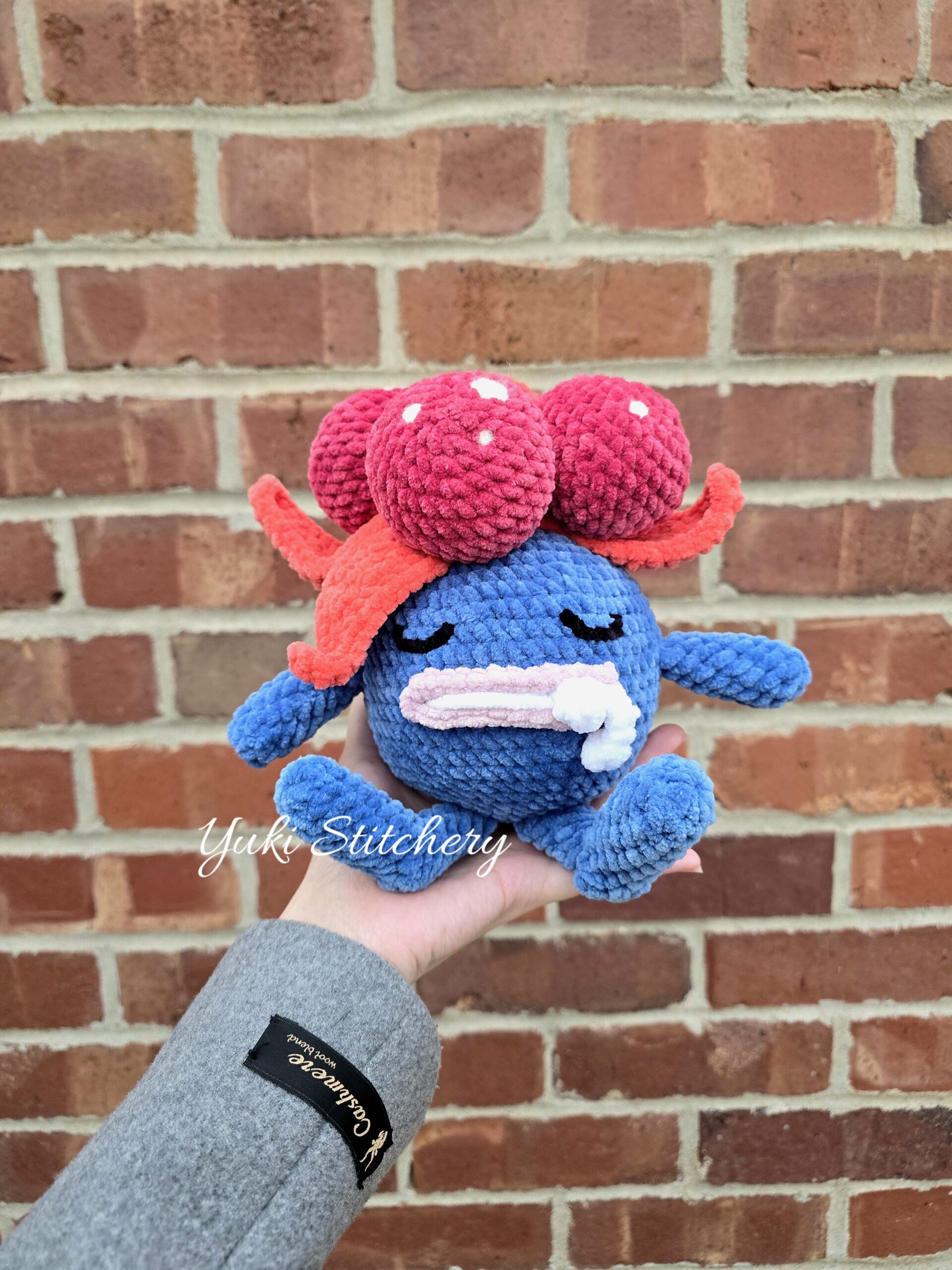 Crochet Gloom about the size that fits in a wide palm.